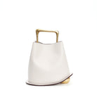 White handbag with gold handle and base on a white background