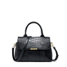 Black textured handbag with a gold clasp on a white background