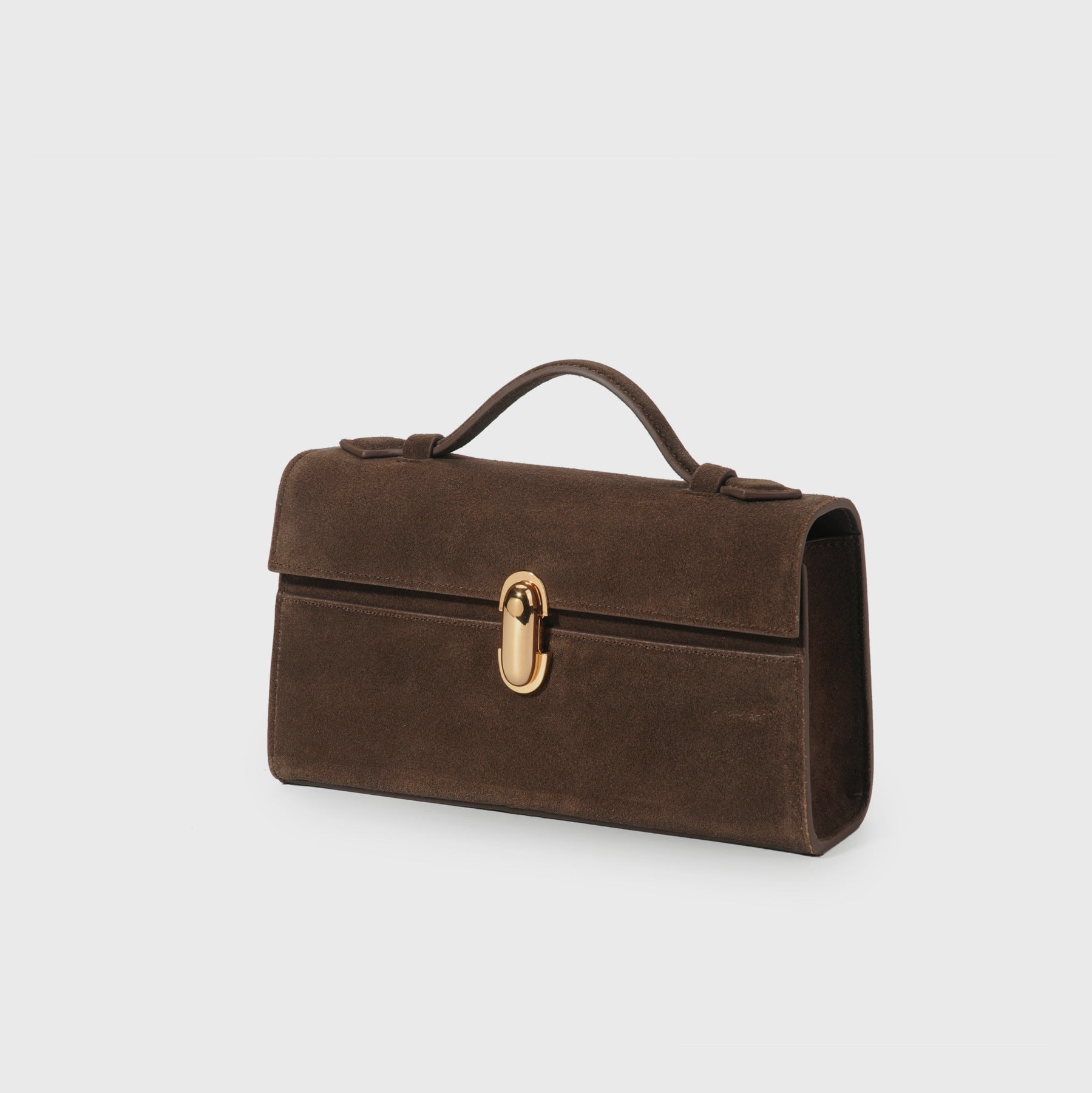 Brown leather handbag with a gold lock on a light gray background