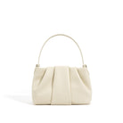 Beige handbag on a white background