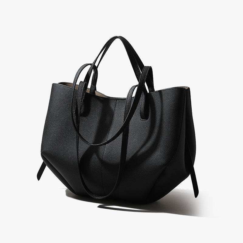 Black handbag on a white background