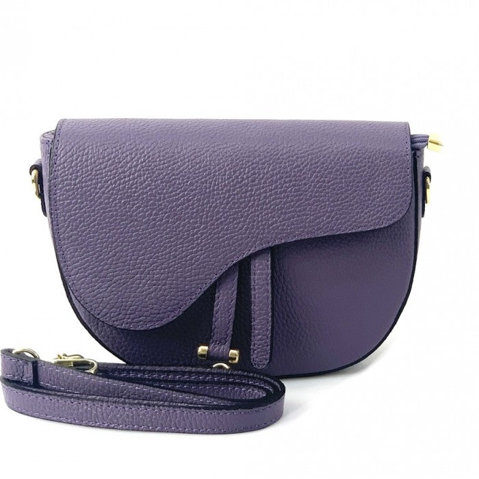Purple leather handbag with a strap on a white background