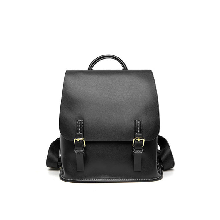 Black backpack with gold buckles on a white background
