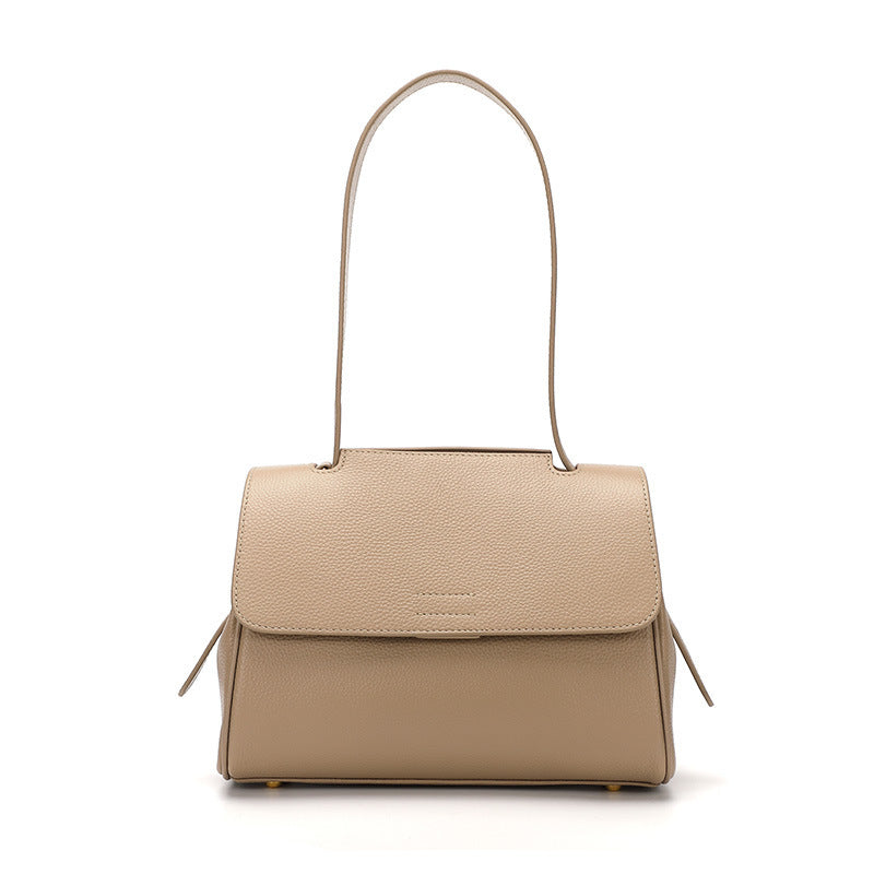 Beige handbag with a flap on a white background