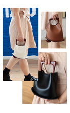Collage of a person holding a brown handbag with a unique handle design.