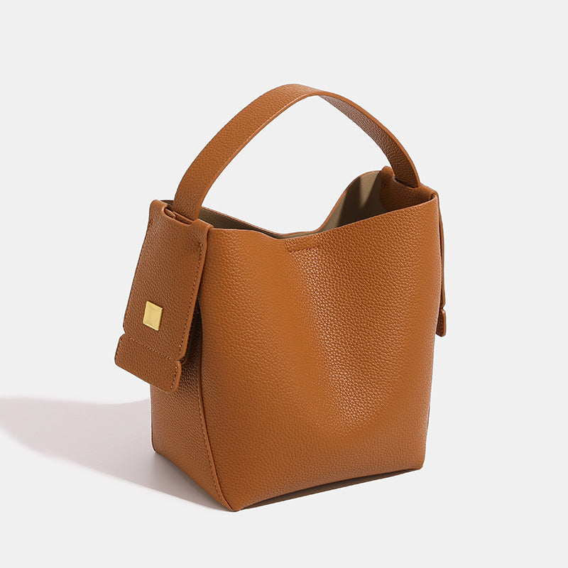 Brown leather handbag on a white background