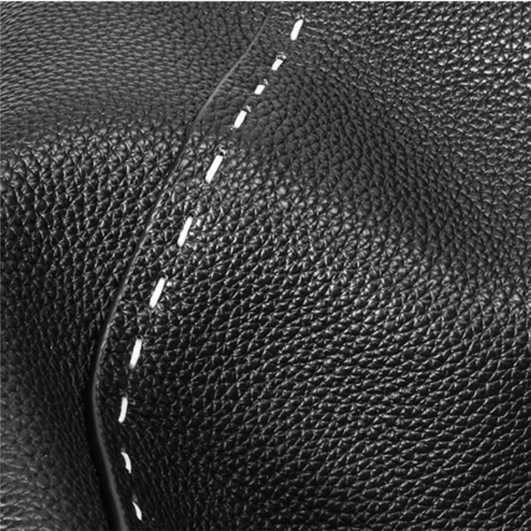 Close-up of black leather with white stitching