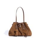 Brown suede handbag with a drawstring on a white background