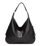 Black leather handbag on a white background