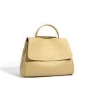 Yellow handbag with a visible brand logo on a white background
