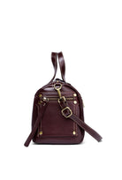 Brown leather backpack with gold accents on a white background