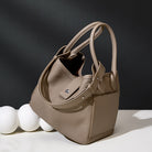 Beige handbag on a black and white background