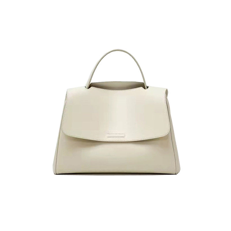 Beige handbag on a white background