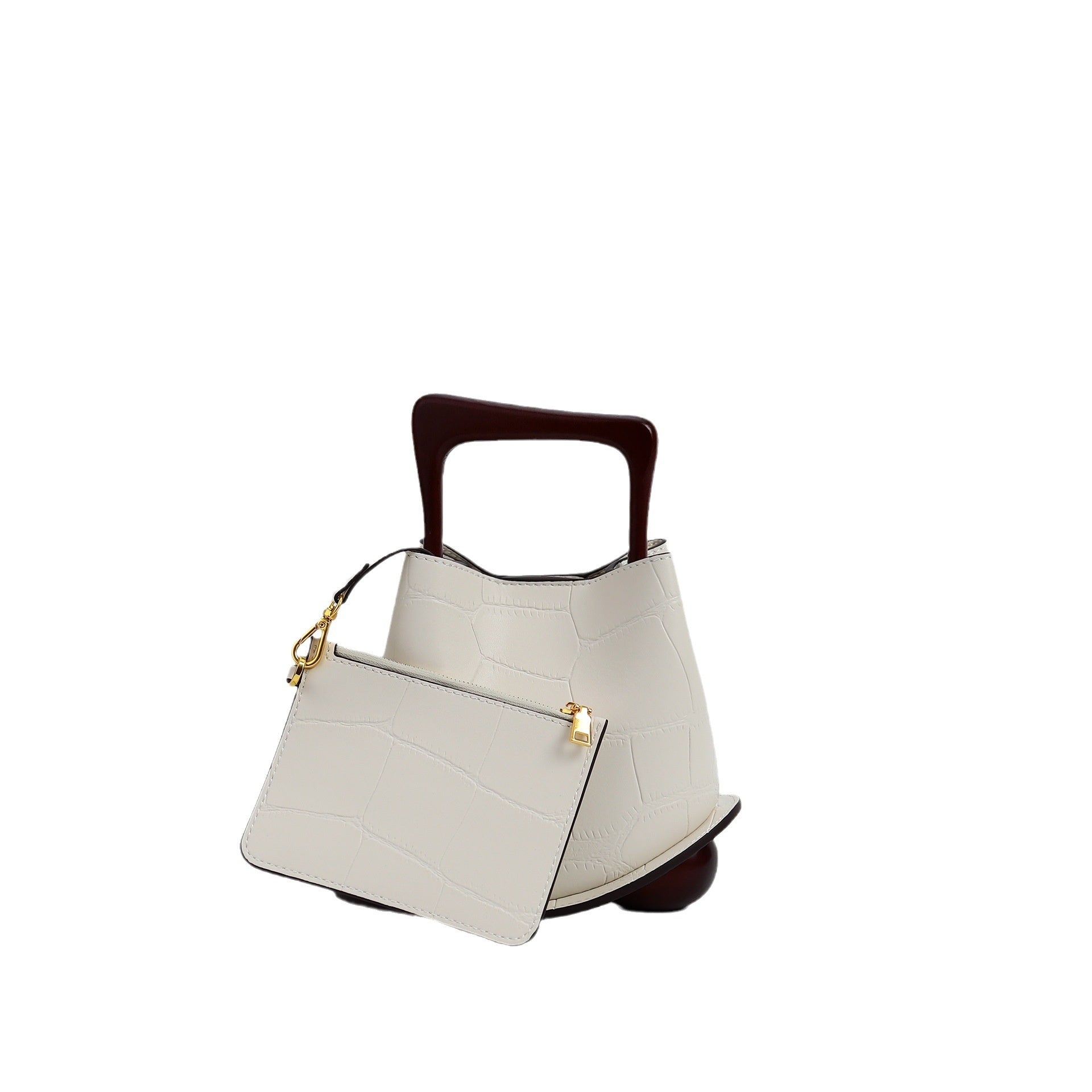 White handbag with wooden handle on a white background