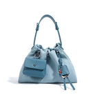 Light blue handbag with a small front pocket on a white background