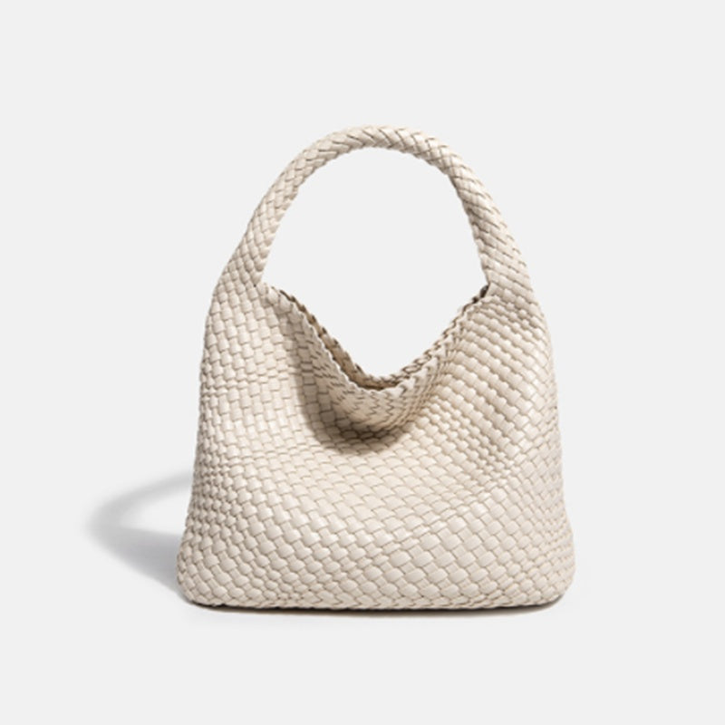 White woven handbag on a light gray background