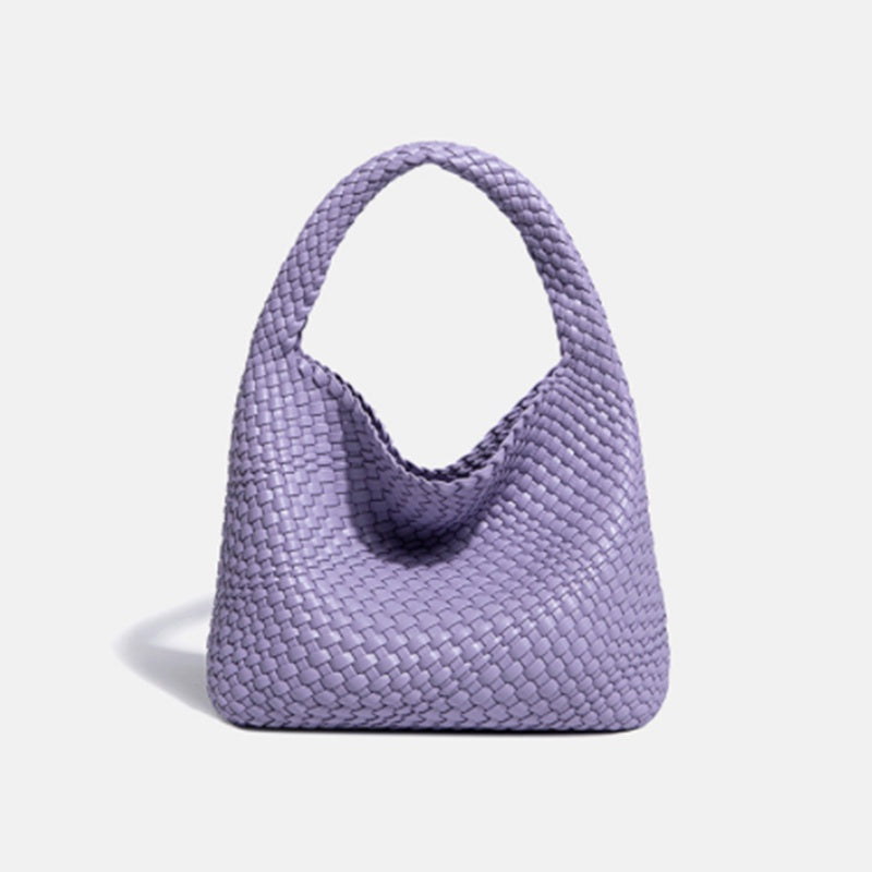 Purple woven handbag on a light gray background