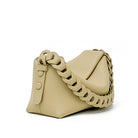 Beige handbag with braided chain strap on a white background