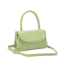 Green handbag with a strap on a white background