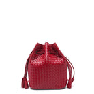 Red woven bucket bag with tassels on a white background