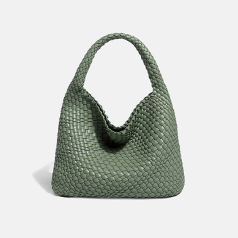 Green woven handbag on a light gray background