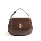 Brown handbag with a gold clasp on a white background