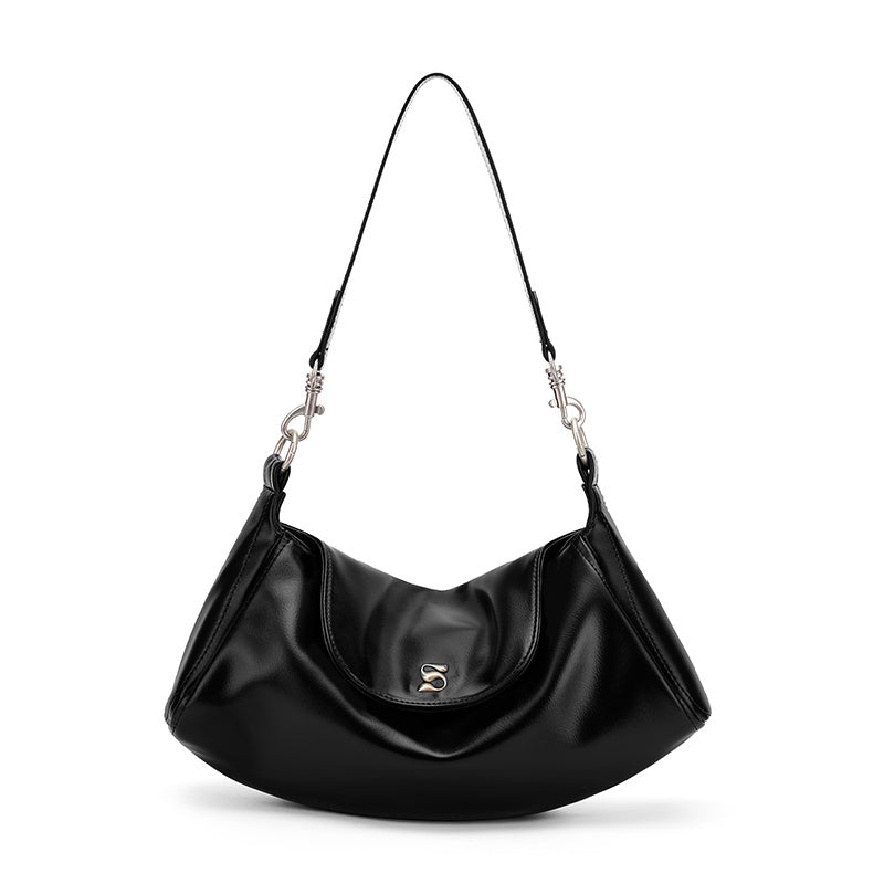 Black handbag with a strap on a white background