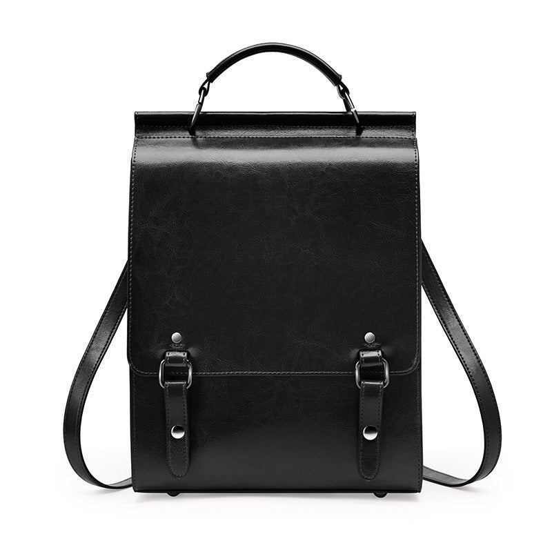 Black leather backpack on a white background