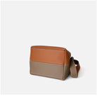 Two-tone brown and beige handbag on a white background