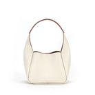 White handbag with brown trim on a white background