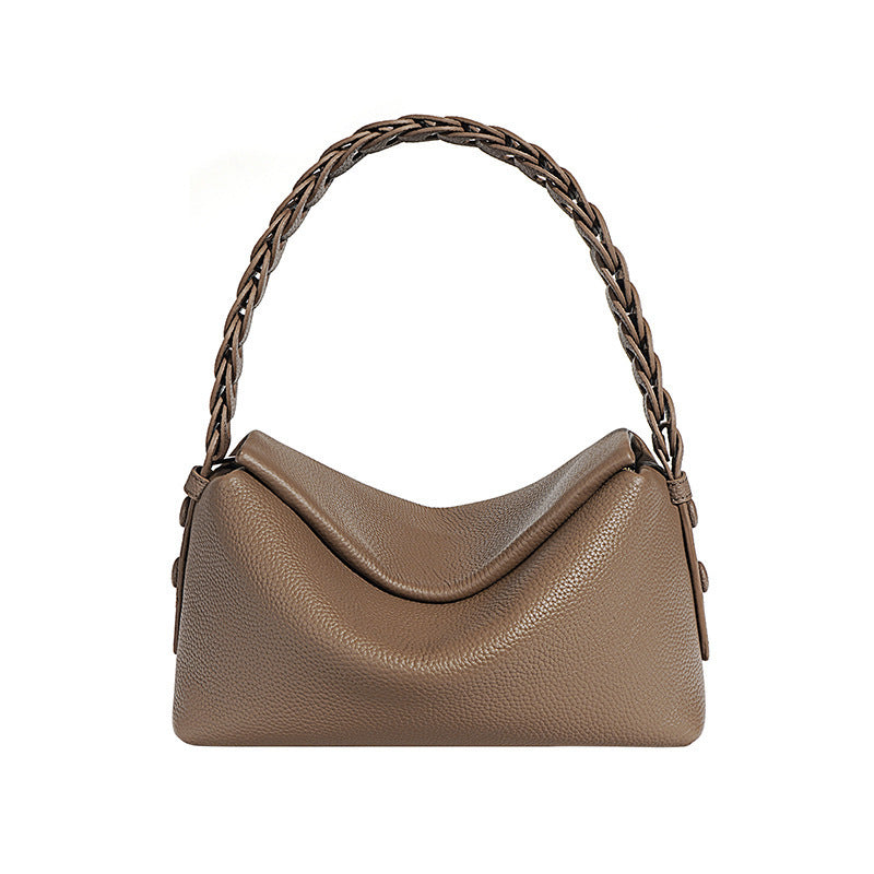 Brown handbag with braided handle on a white background