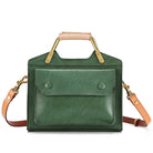 Green handbag with gold handles and accents on a white background