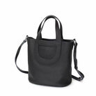 Black handbag with a shoulder strap on a white background
