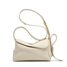 Beige handbag with a strap on a white background