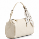 An off-white textured leather handbag with a matching top handle and a decorative cream satin scarf tied to the handle, featuring silver-tone chain link details.