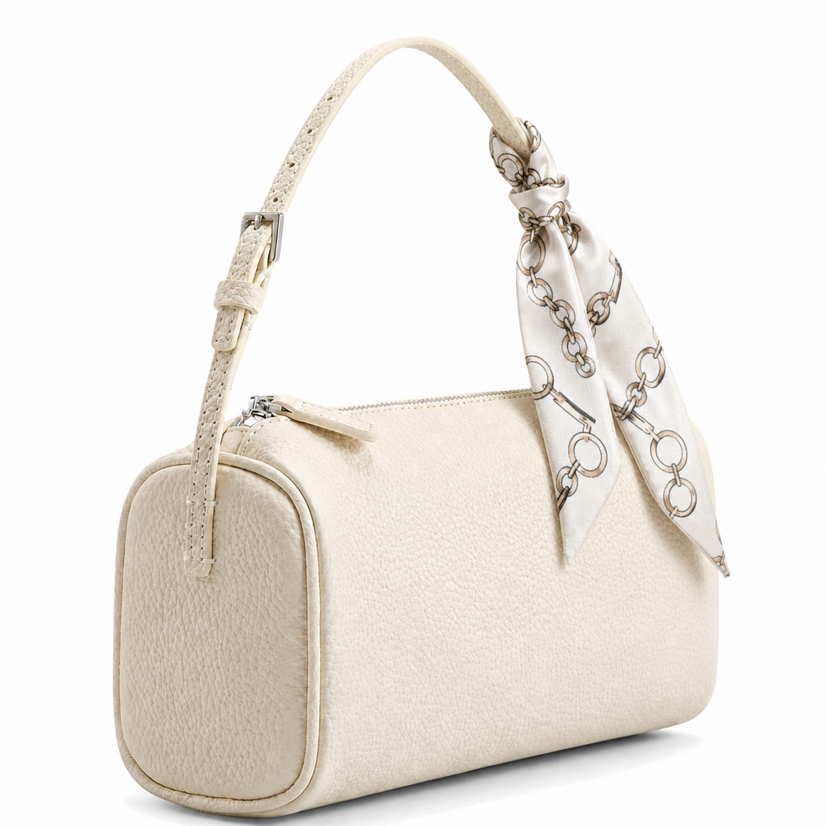 An off-white textured leather handbag with a matching top handle and a decorative cream satin scarf tied to the handle, featuring silver-tone chain link details.