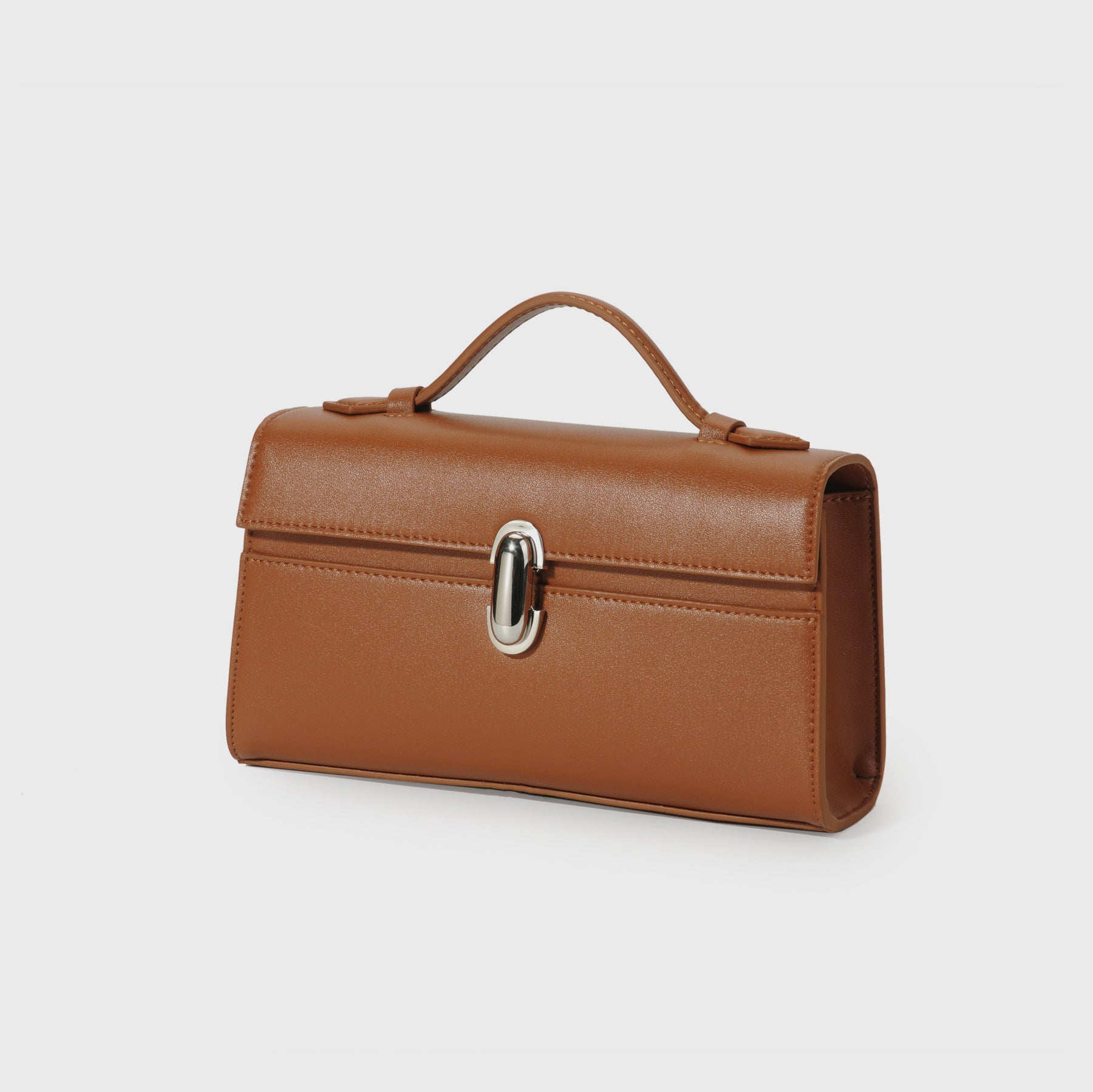 Brown leather handbag with a silver clasp on a light gray background