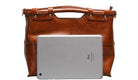 Brown leather briefcase with a silver tablet on a white background