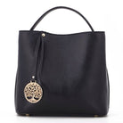 Black handbag with a gold tree of life pendant on a white background