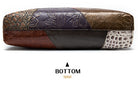 Multicolored leather clutch with embossed patterns on a white background