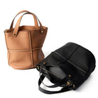 Brown leather tote bag and black leather backpack on a white background