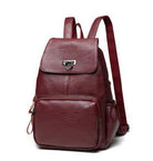 Maroon backpack with a silver buckle on a white background