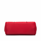 Red cylindrical bag on a white background