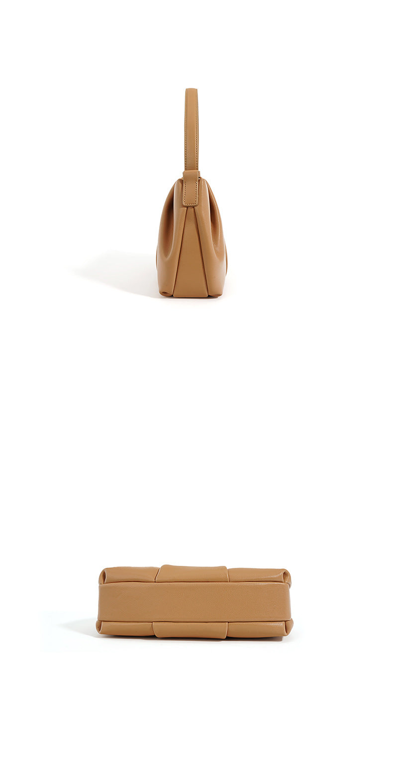 Tan handbag on a white background