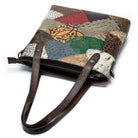 Patchwork handbag with various textures and patterns on a white background
