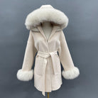 Beige coat with fur trim on a mannequin against a gray background