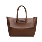Brown leather handbag on a white background