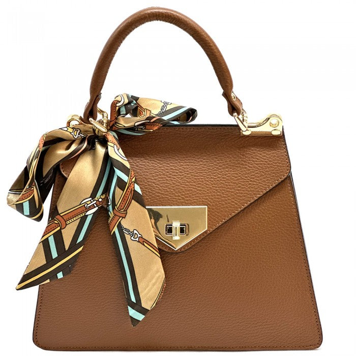 Brown handbag with a decorative scarf on a white background