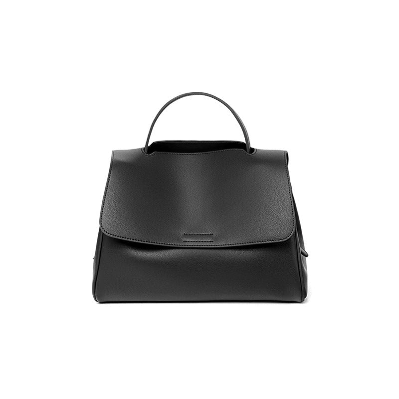 Black leather backpack on a white background