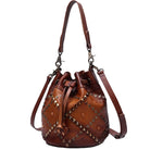 Brown leather bag with studded details on a white background